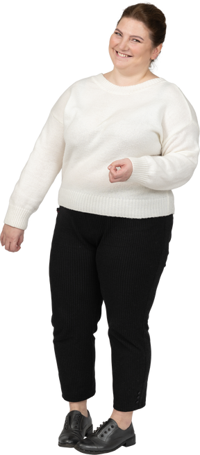 Happy plump woman in casual clothes smiling