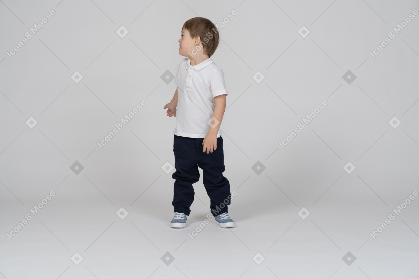 Front view of a little boy turning around