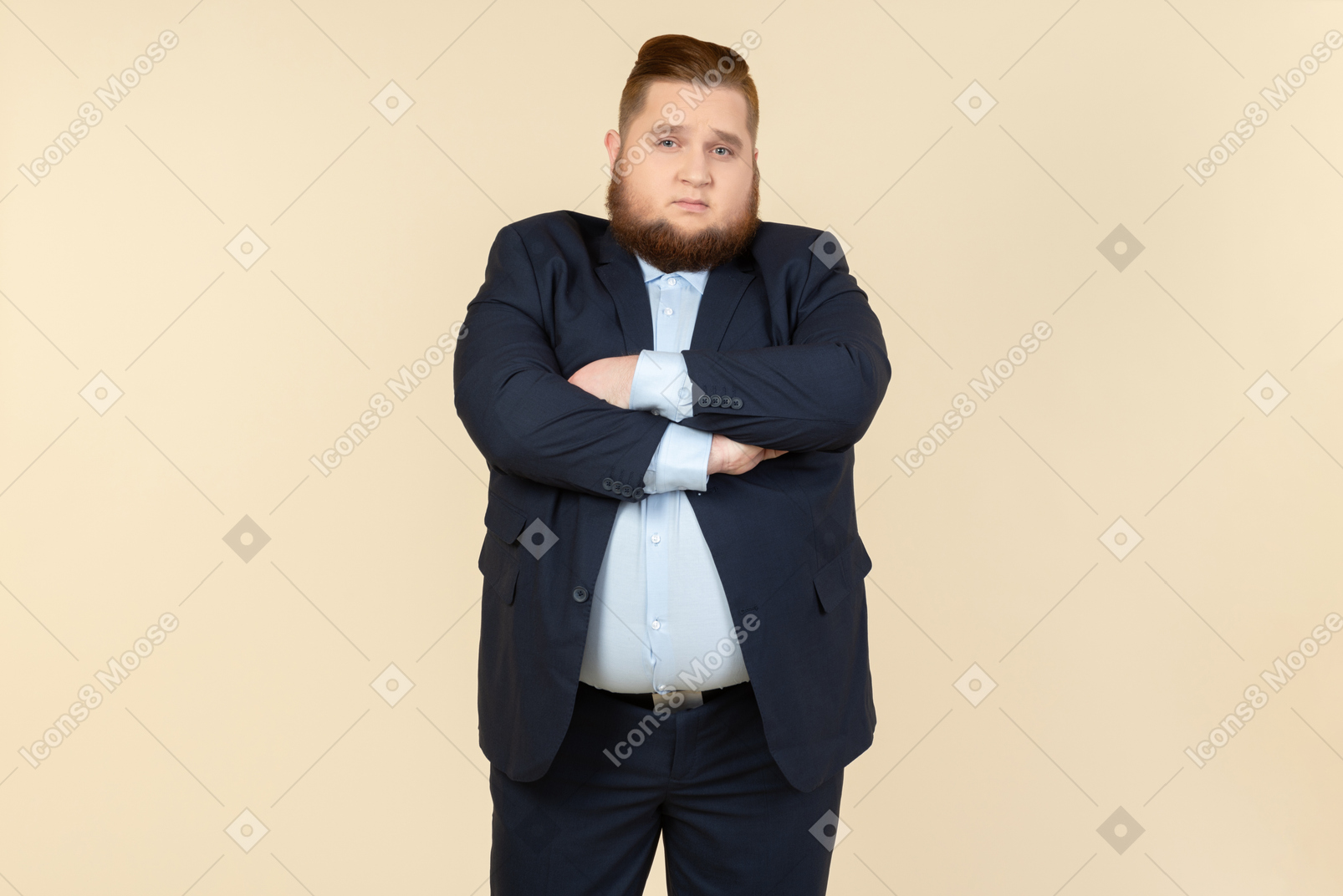 Offended looking young overweight office employee standing with his hands crossed