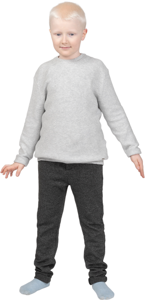 Front view of a boy standing and smiling
