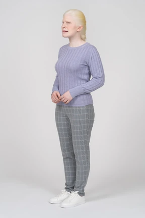 Front view of a confused woman in casual clothes