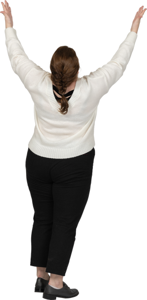 Rear view of a plus size woman in casual clothes with raised arms