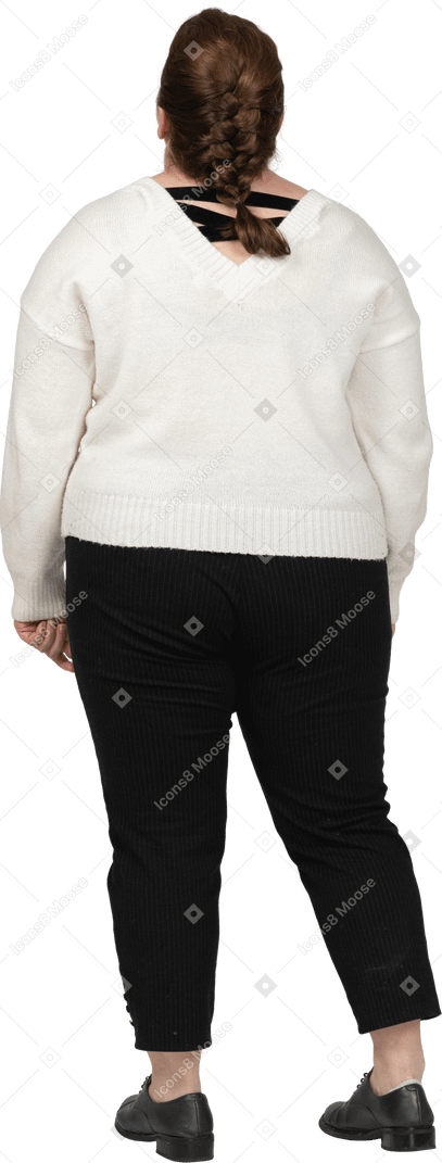 Plump woman in casual clothes looking up