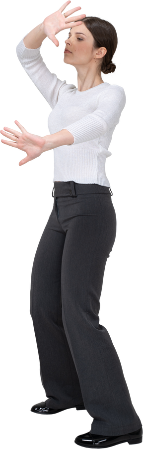 Front view of a woman in suit dancing