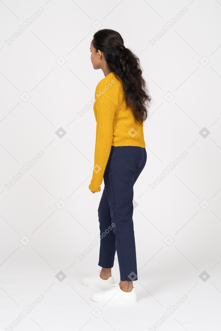 Side view of a girl in casual clothes staring at something