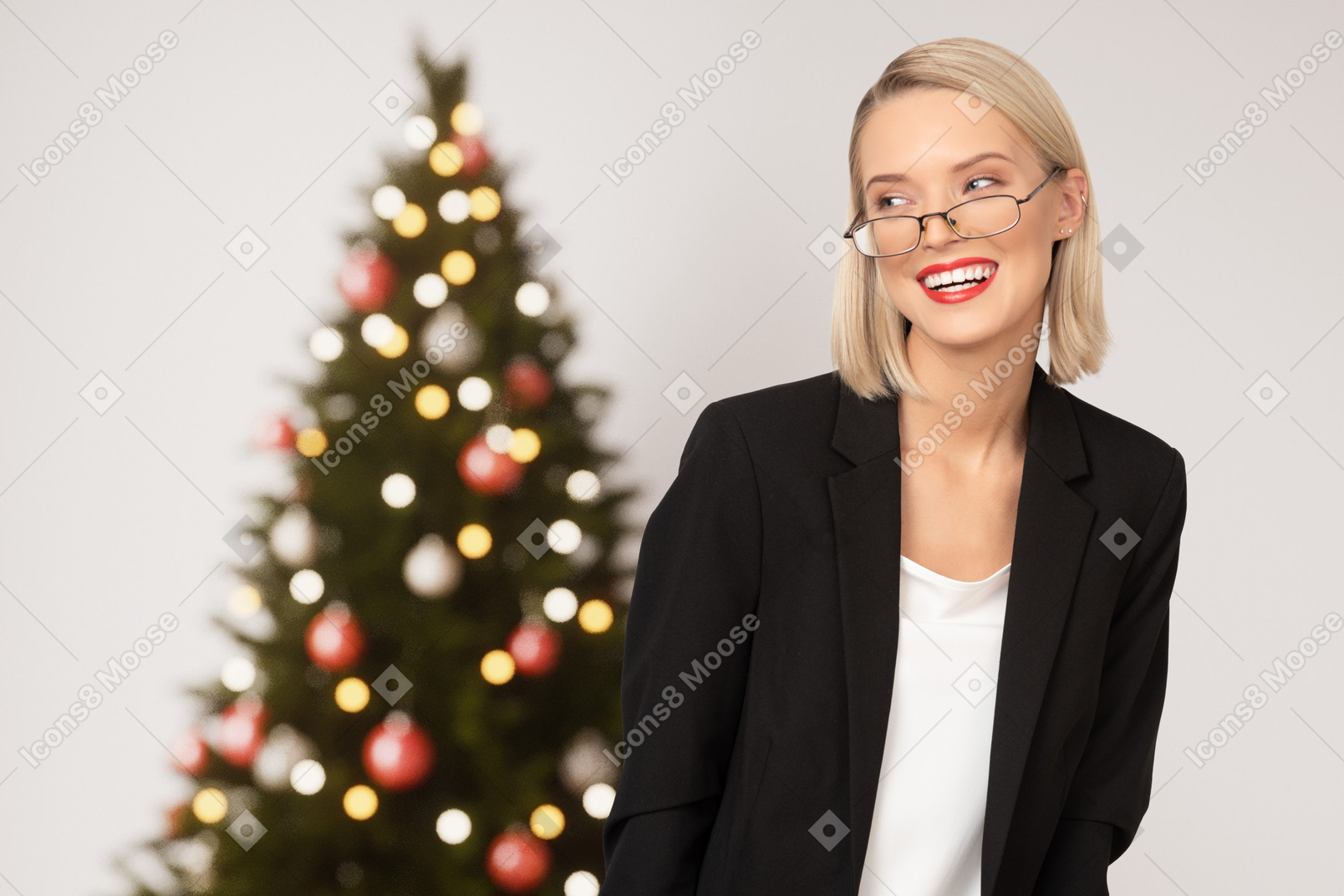 Young businesswoman near a christmas tree