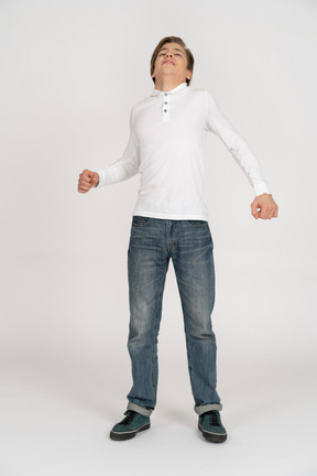 Young man in casual clothes standing