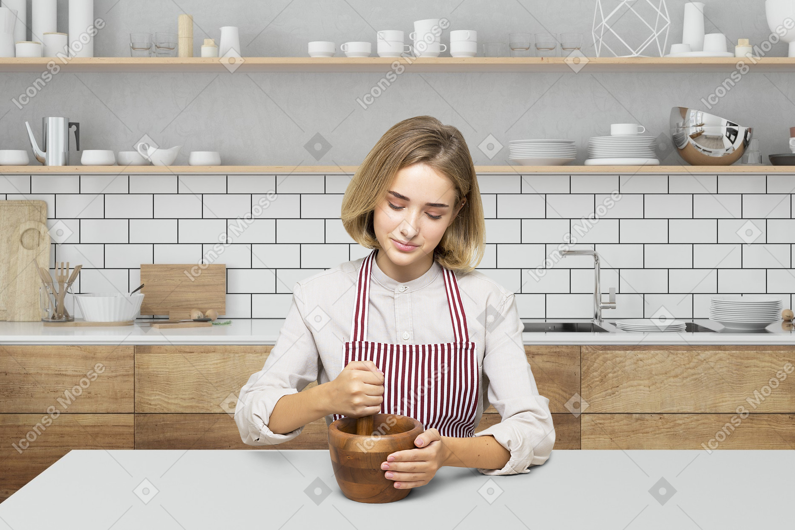 A woman in an apron mixing a cup in a kitchen