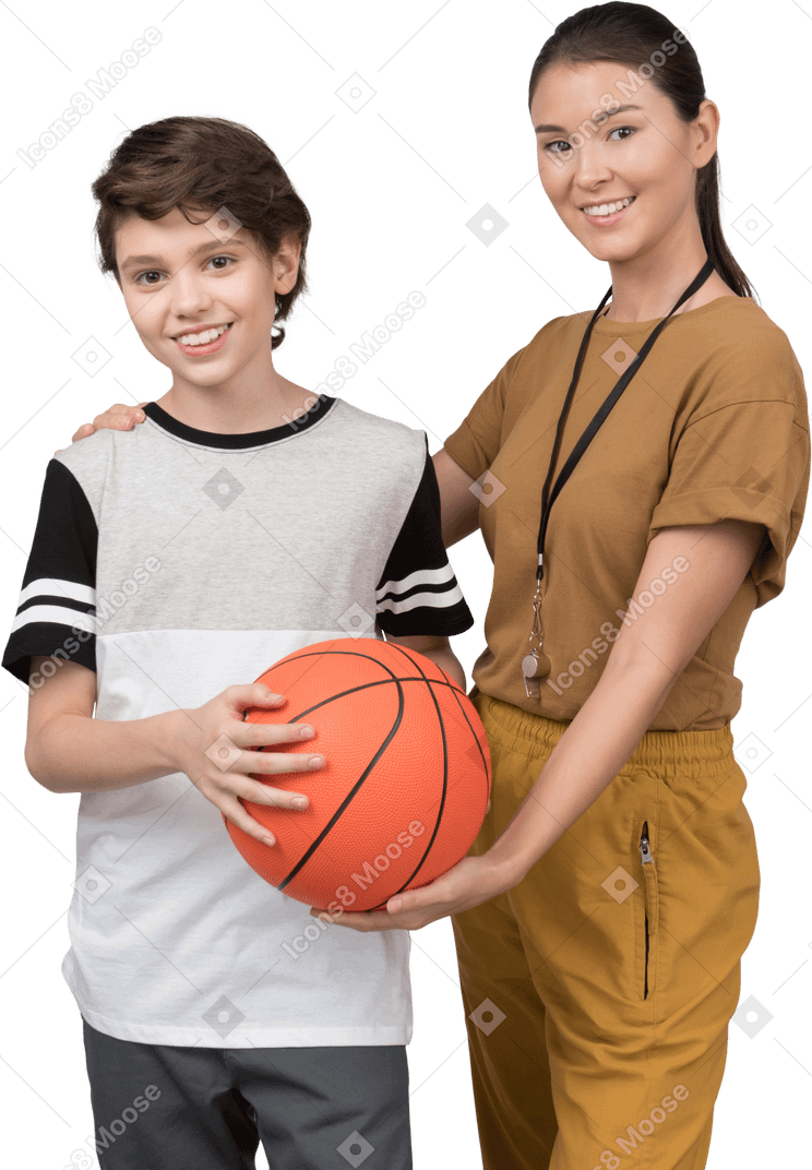 Pe teacher and pupil holding basketball ball
