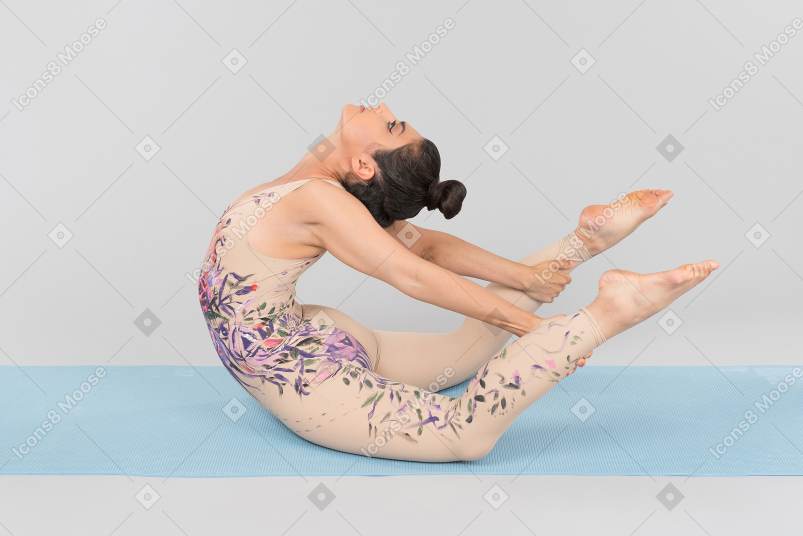 Young indian gymnast sitting on yoga mat