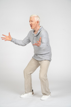 Man standing and spreading his arms