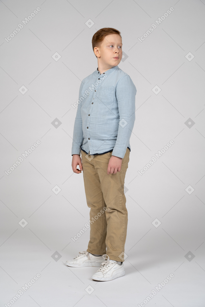 Three-quarter view of a cute boy looking aside