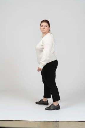 Side view of plump woman in casual clothes