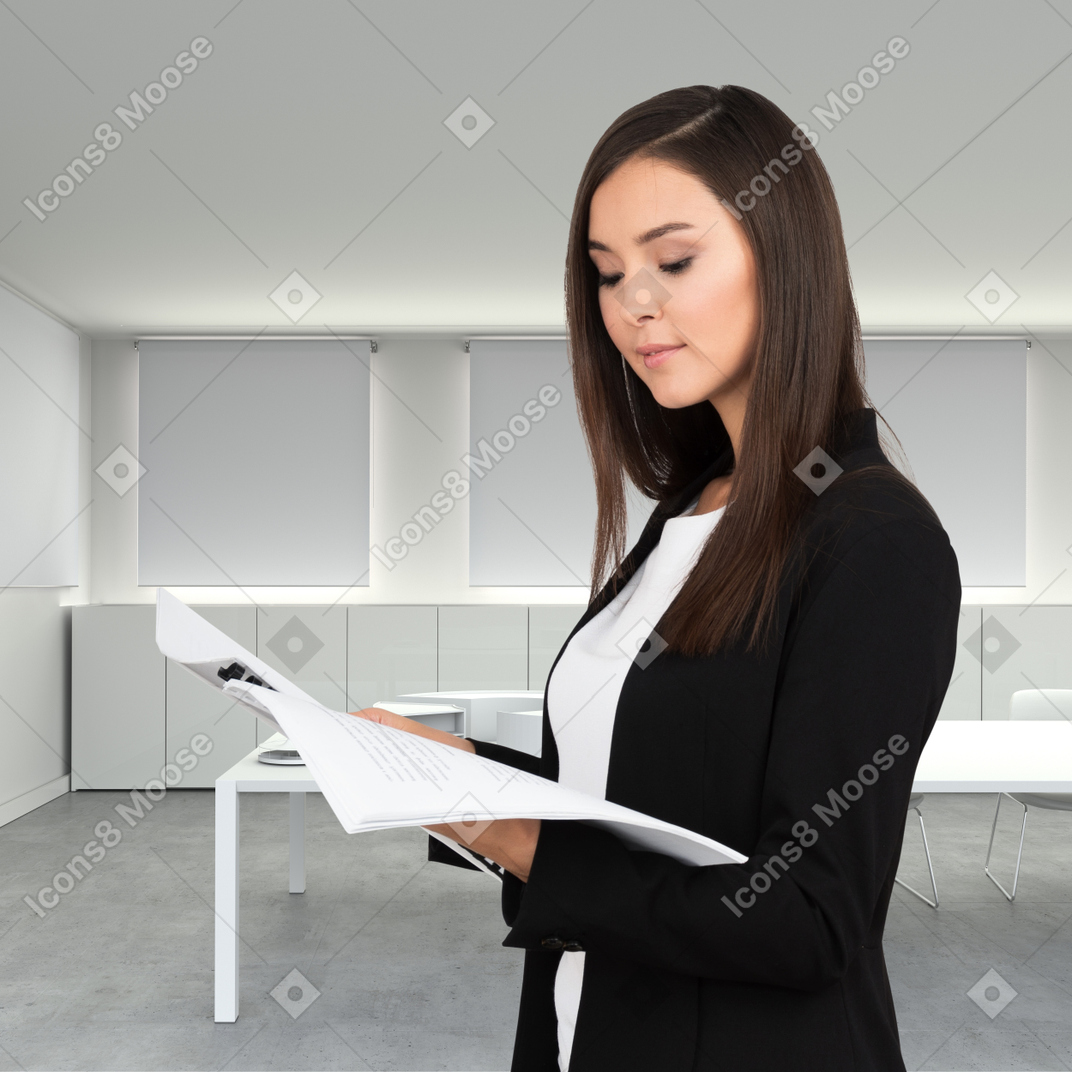 Woman in formal wear holding documents
