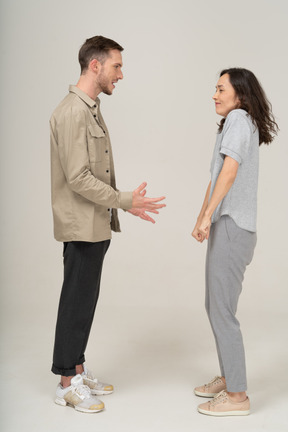 Side view of young couple speaking to each other