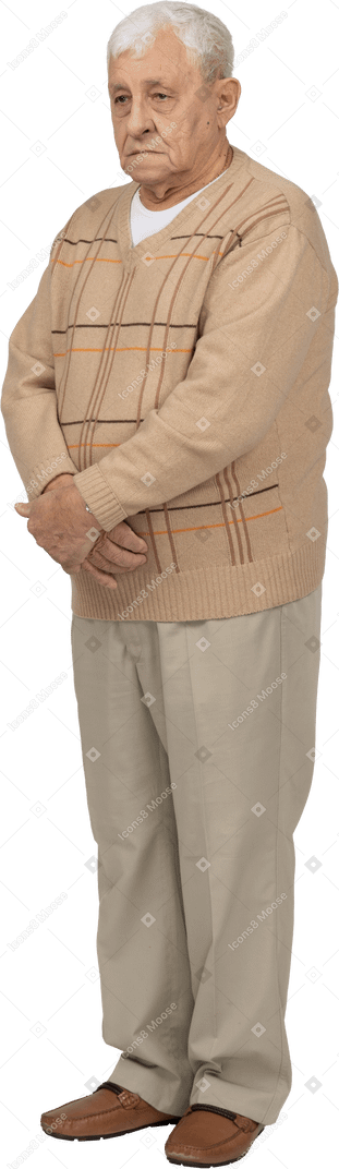 Old man in casual clothes standing still