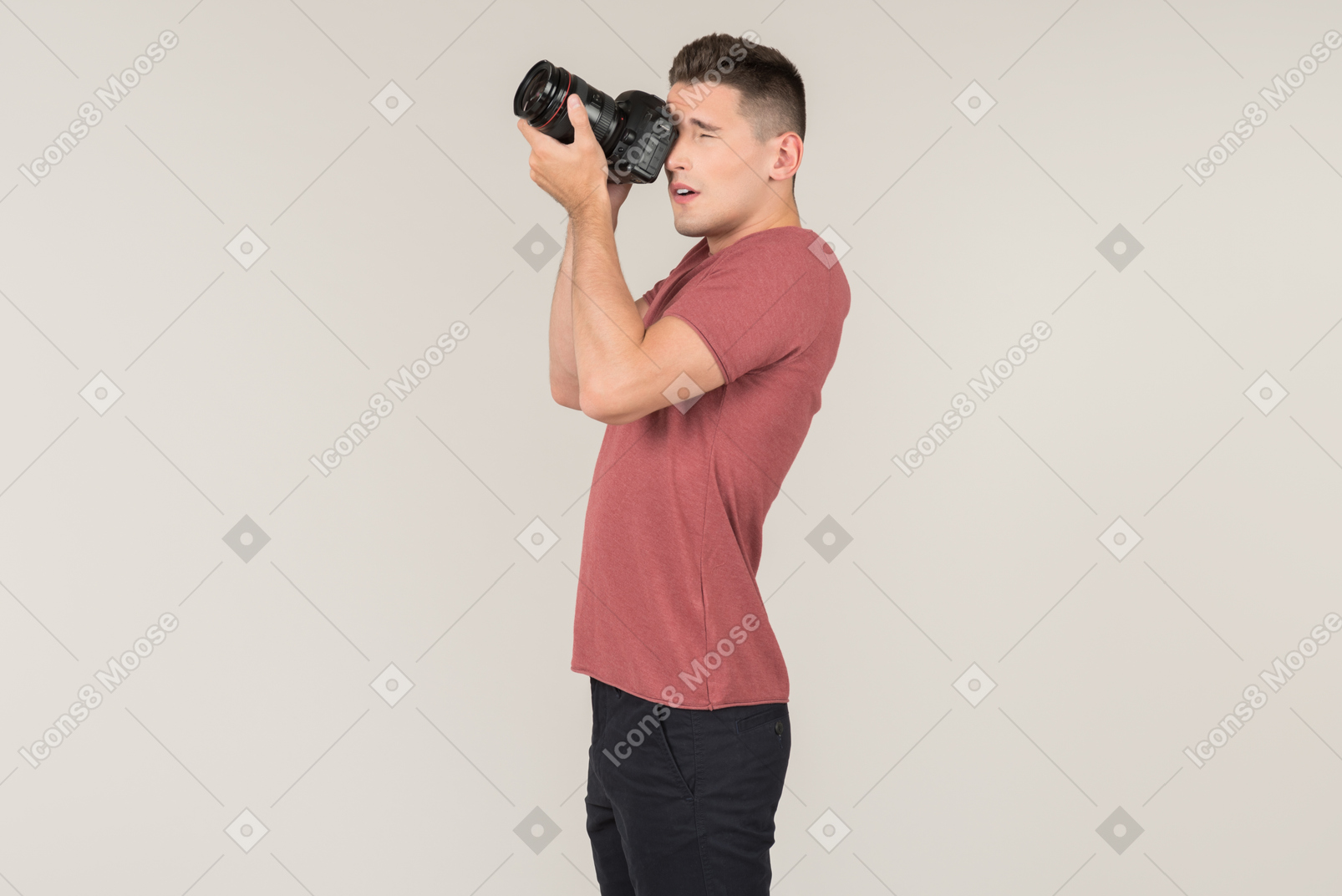 Young guy taking photos with a camera