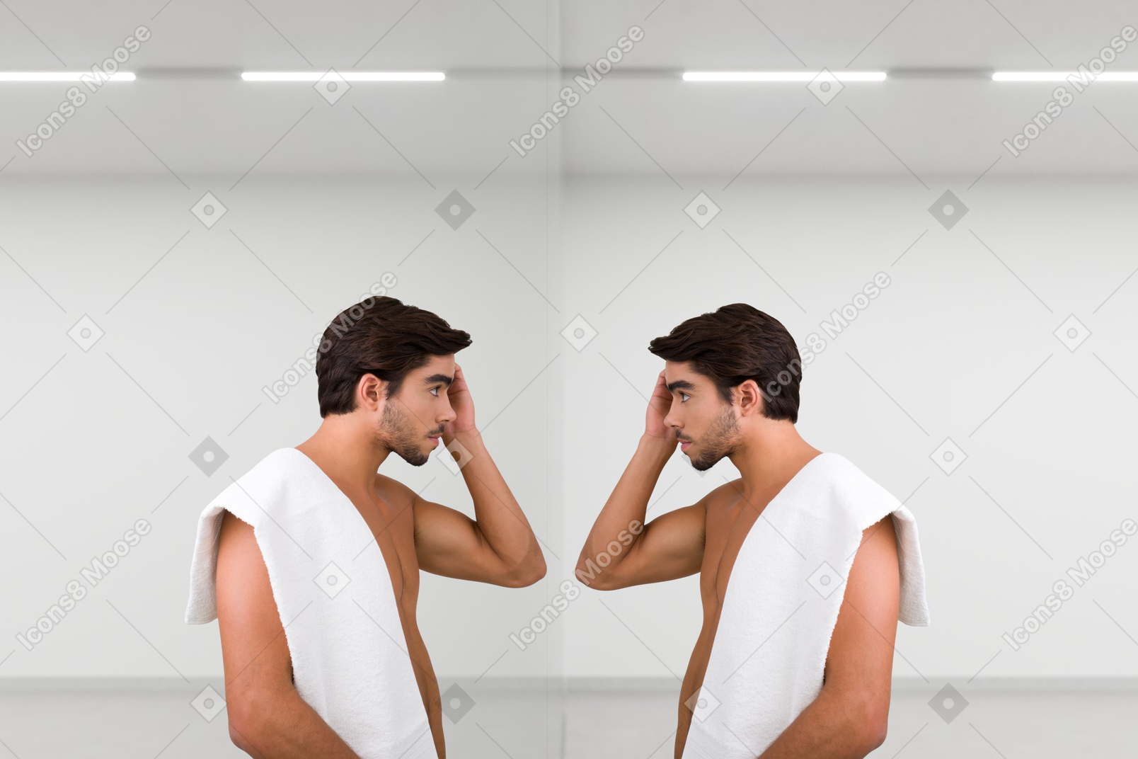 A man with a towel on his back looking at himself in the mirror