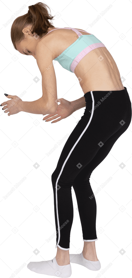 Three Quarter Back View Of A Teen Girl In Sportswear Bending Over And Raising Her Hands Photo