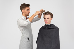 A young barber and his client