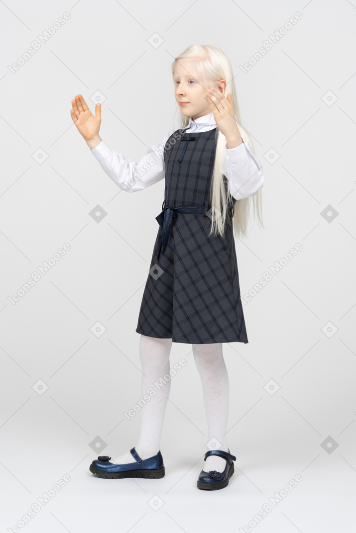 Schoolgirl showing the length of something
