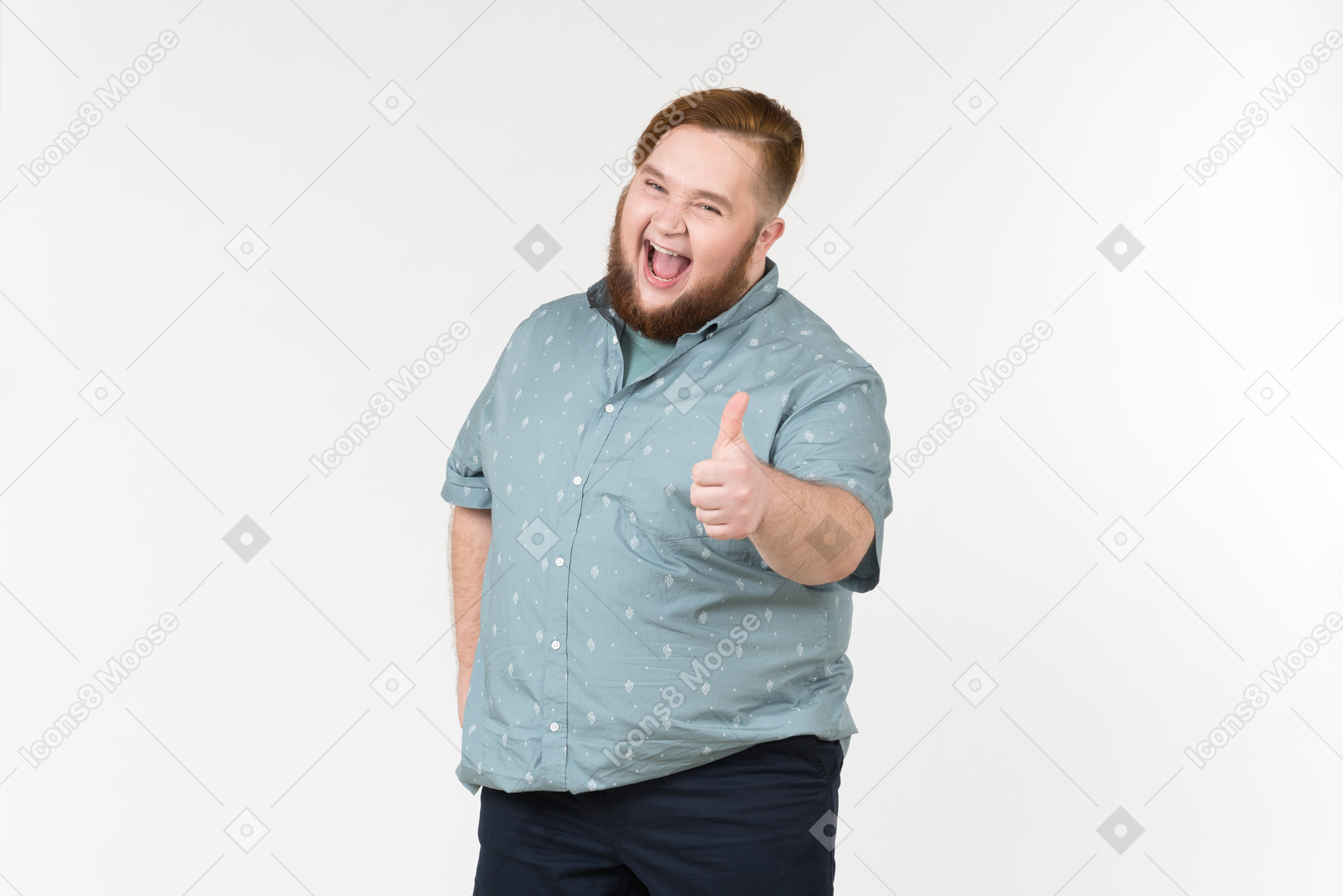Excited young overweight man showing thumbs up