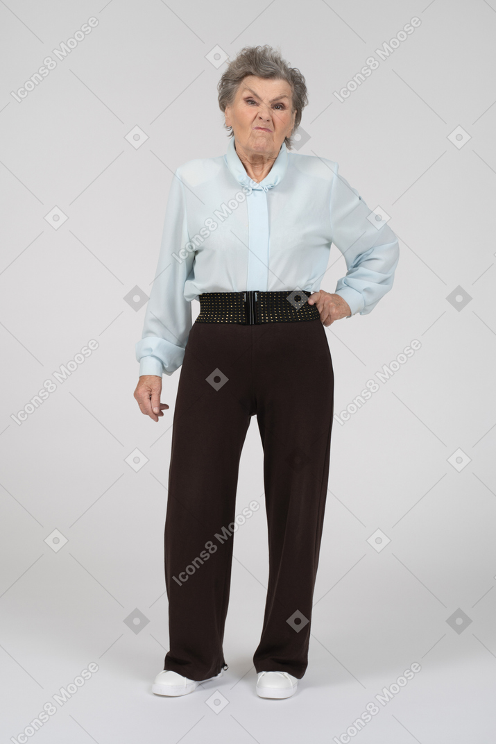 Front view of an old woman with a disgruntled wrinkled expression