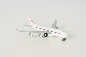 Toy airplane on grey background