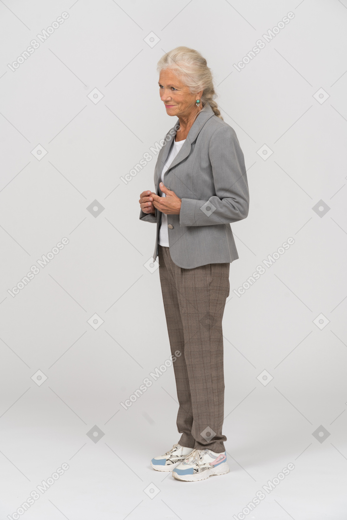 Old lady in suit standing in profile