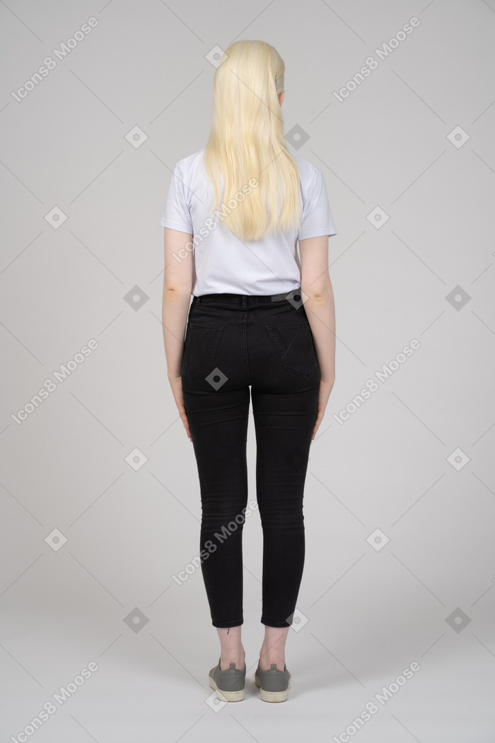 Back view of a long-haired girl in casual clothes