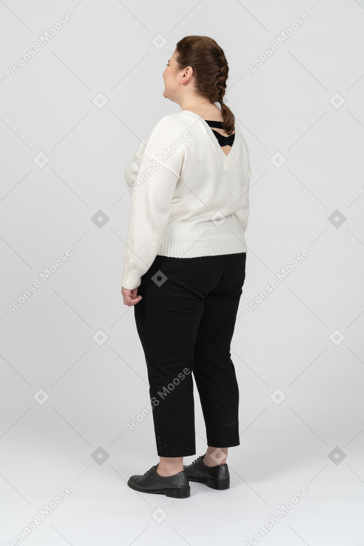 Plump woman in casual clothes standing