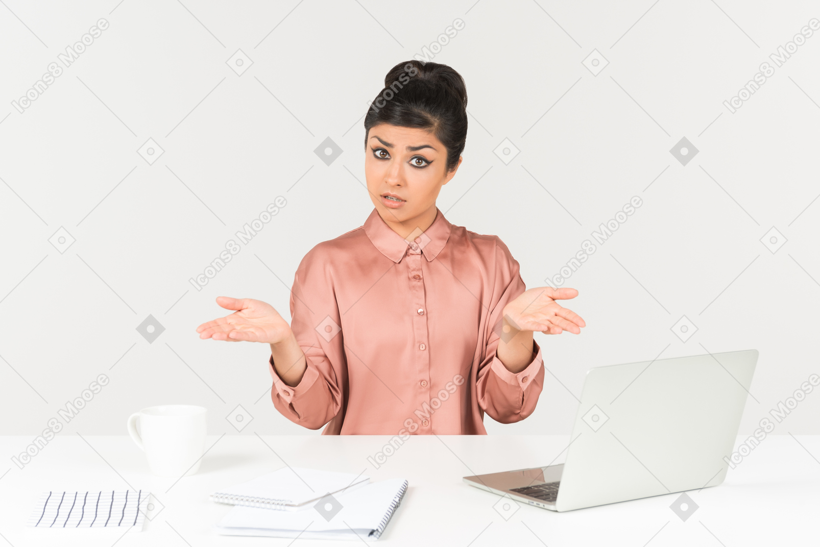 Not understanding something young indian woman sitting at the office desk