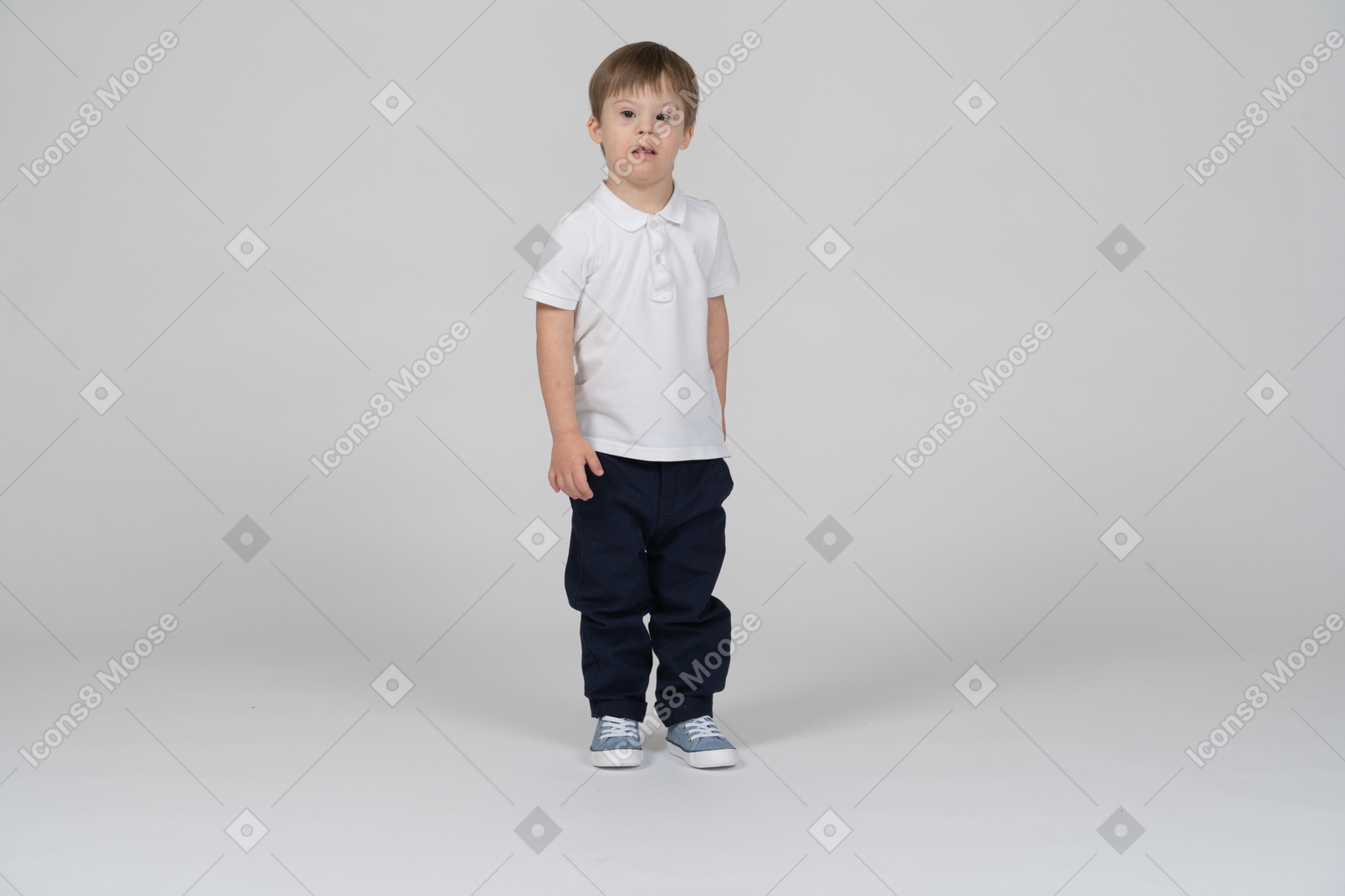 Front view of little boy standing upright