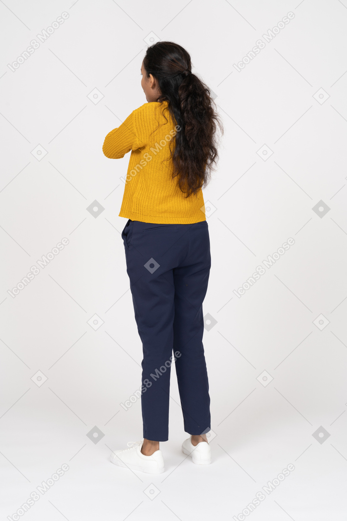 Rear view of a girl in casual clothes chocking herself