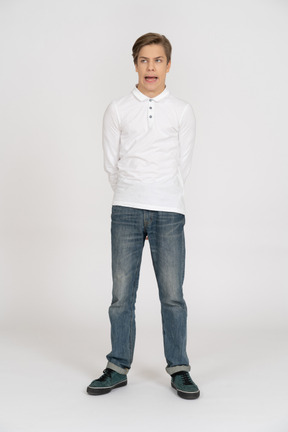 Young man in casual clothes standing