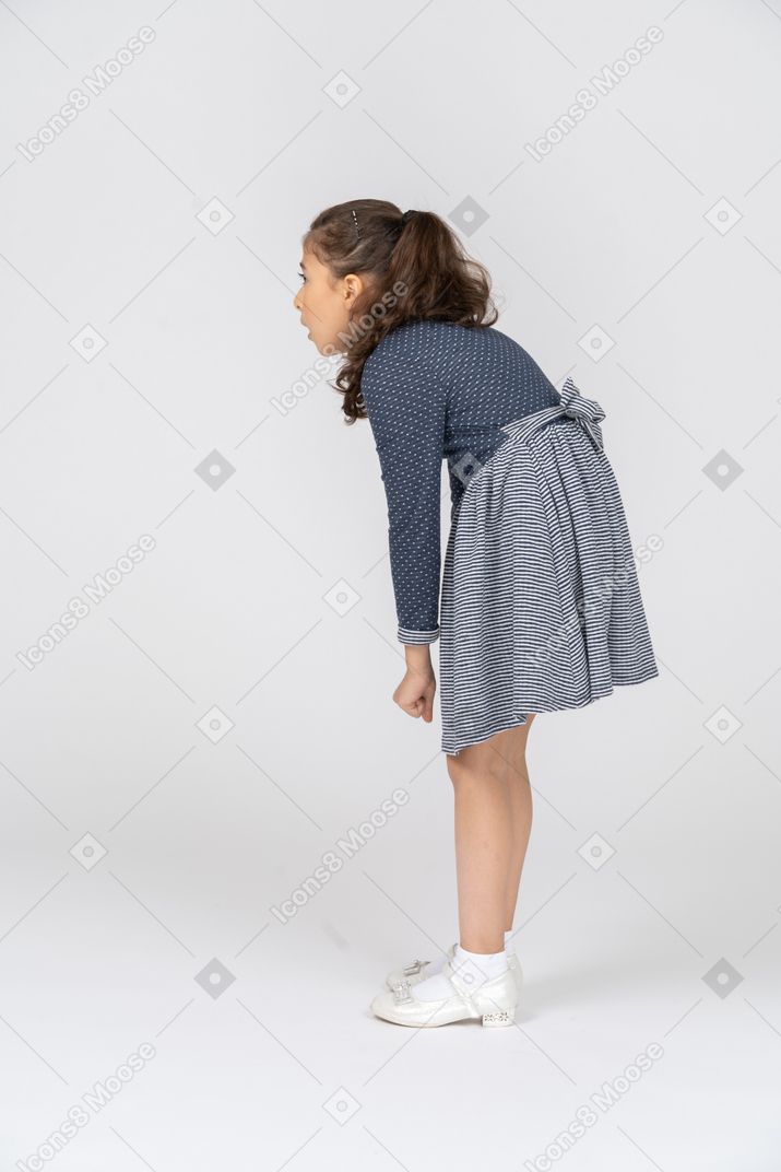 Three-quarter back view of a girl slouching forward