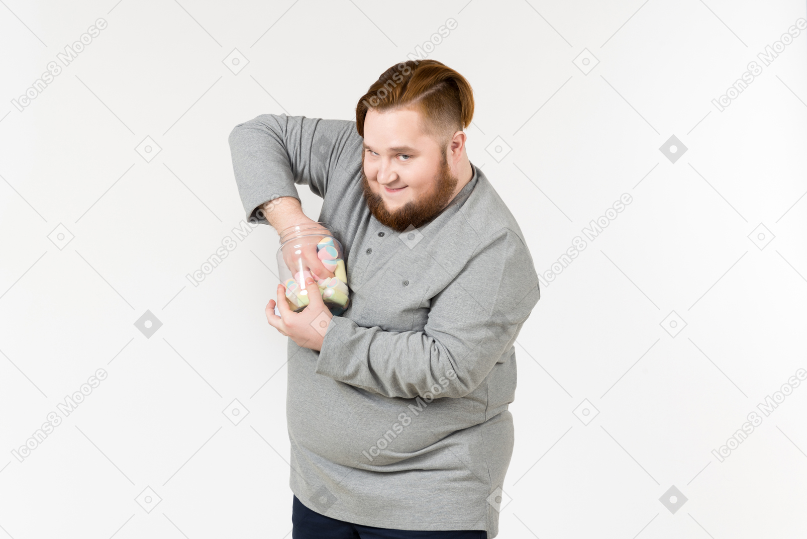 Big bearded man trying to reach marshmallows from the jar
