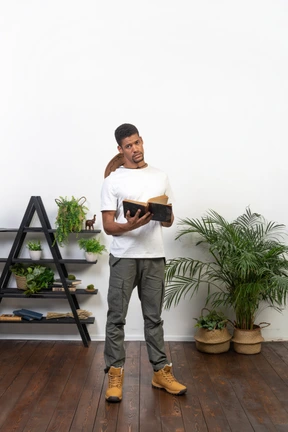 Good looking young man with a book