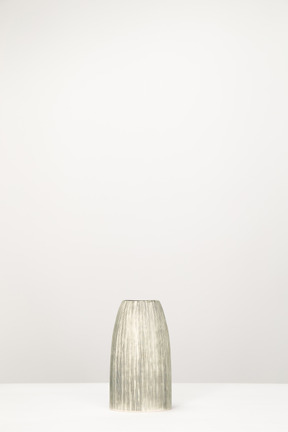 Empty metallic vase on the table
