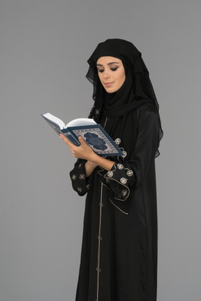 A muslim woman reading the quran