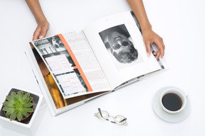 Female hands holding an open book