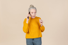 Aged woman involved in phone discussion