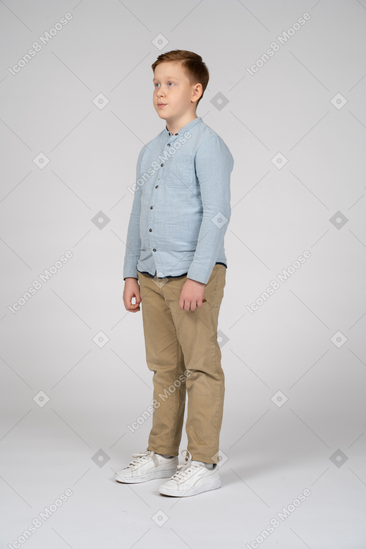 Three-quarter view of a boy in casual clothes