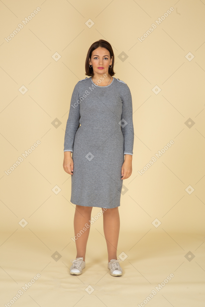 Front view of a woman in grey dress