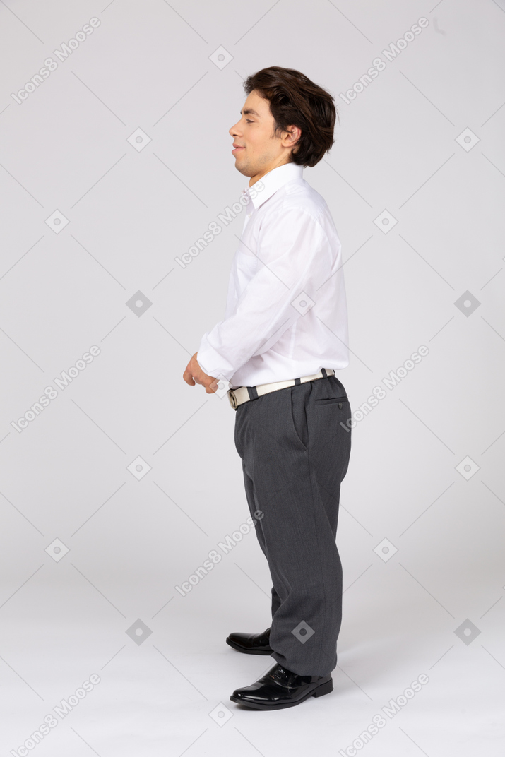 Side view of a contented man in business casual clothes