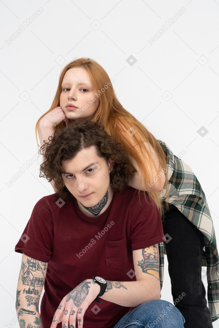 Teenage girl leaning on her friend's back