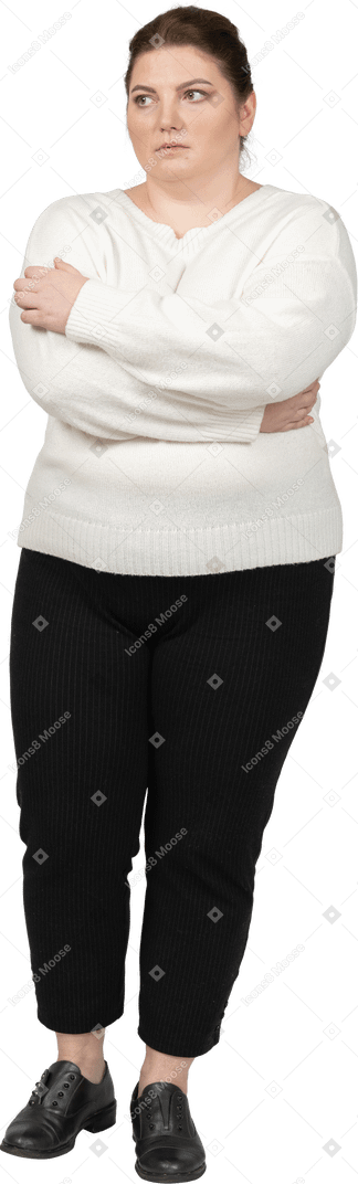 Plus size woman in casual clothes keeping arms crossed