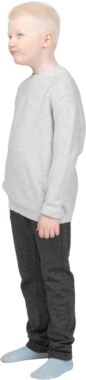 Full-length of a little boy in casual clothes teasing