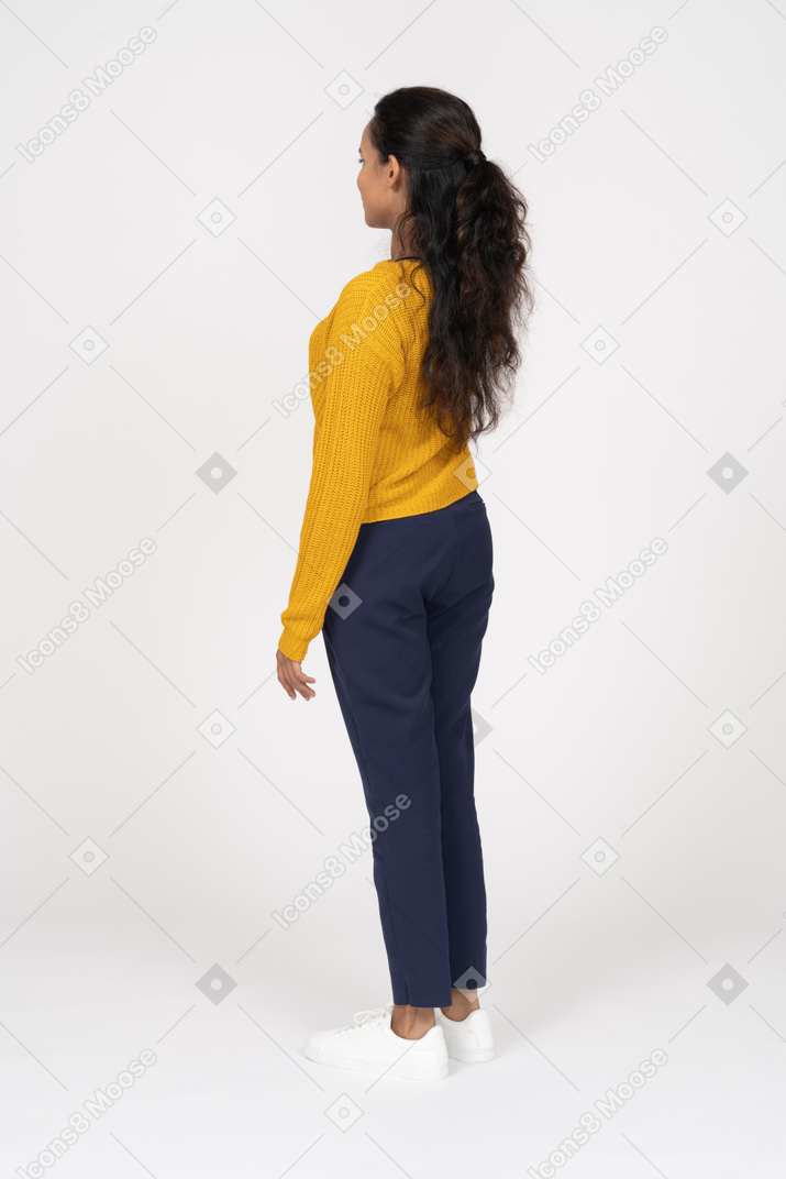 Side view of a girl in casual clothes saluting with hand