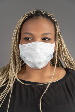 American woman wearing respiratory mask during coronovirus pandemic